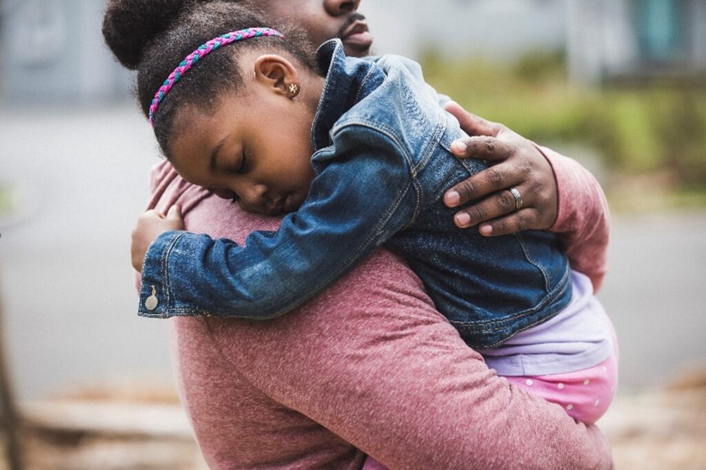 Father hugging child -National Child Protection Wee